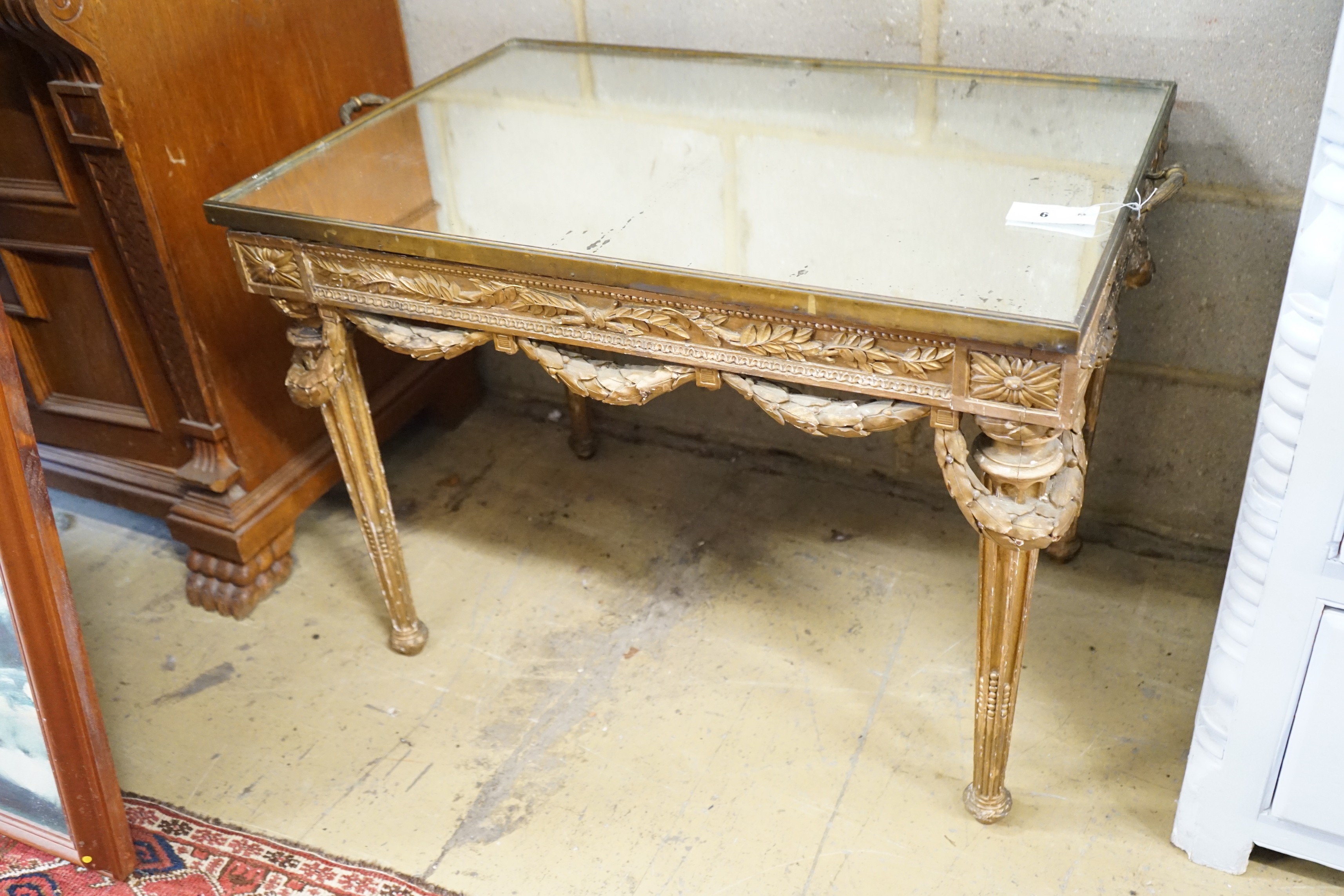 An 18th century style rectangular giltwood and gesso mirrored tray top table, width 80cm, depth 56cm, height 61cm